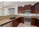 Well-equipped kitchen featuring granite countertops and stainless steel appliances at 2127 E Huntington Dr, Phoenix, AZ 85040