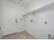 Laundry room with shelving and tile floor at 2127 E Huntington Dr, Phoenix, AZ 85040