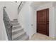Interior staircase with carpet runner and metal railing at 2127 E Huntington Dr, Phoenix, AZ 85040