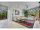 Relaxing sitting area with a comfortable sofa and views of the pool area at 8517 N 48Th Pl, Paradise Valley, AZ 85253