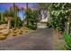 Mid-century modern home with desert landscaping and driveway at 8517 N 48Th Pl, Paradise Valley, AZ 85253