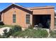 Rear view of the house with covered patio at 46157 W Holly Dr, Maricopa, AZ 85139