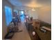 Dining area with tile floor and view into living room at 46157 W Holly Dr, Maricopa, AZ 85139