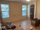 Bright living room with large windows and tile floors at 46157 W Holly Dr, Maricopa, AZ 85139
