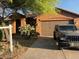 One-story home with two-car garage and landscaped yard at 46157 W Holly Dr, Maricopa, AZ 85139
