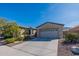 House exterior with two car garage and desert landscaping at 2323 W Kachina Trl, Phoenix, AZ 85041