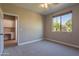 Bedroom with large window and access to private office at 3802 N 147Th Dr, Goodyear, AZ 85395