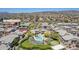 Aerial view showing condo building, pool, and assigned parking location #1136 at 16013 S Desert Foothills Pkwy # 1136, Phoenix, AZ 85048