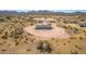 Aerial view of the property showing house and desert landscape at 1023 N Ralston Rd, Maricopa, AZ 85139