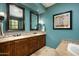 Spa-like bathroom with double vanity, large mirrors, and soaking tub at 38749 N 104Th Way, Scottsdale, AZ 85262