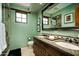Double vanity bathroom with granite countertops and a walk-in shower at 38749 N 104Th Way, Scottsdale, AZ 85262