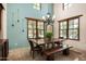 Bright dining room features a large table, bench, and plenty of natural light at 38749 N 104Th Way, Scottsdale, AZ 85262