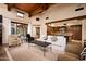 Spacious living room with high ceilings and exposed wooden beams at 38749 N 104Th Way, Scottsdale, AZ 85262