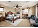 Spacious Primary bedroom with a king-size bed and access to a private balcony at 38749 N 104Th Way, Scottsdale, AZ 85262