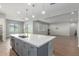 Modern kitchen island with white countertops and gray cabinets at 5139 N 185Th Ave, Litchfield Park, AZ 85340