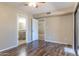 Bright bedroom with wood-look floors and access to bathroom at 1972 S Clubhouse Dr, Casa Grande, AZ 85194