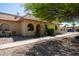 House exterior with walkway, landscaping, and seating area at 1972 S Clubhouse Dr, Casa Grande, AZ 85194