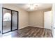 Bedroom with wood-look floors and access to a patio at 1972 S Clubhouse Dr, Casa Grande, AZ 85194