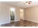 Bedroom with wood-look flooring and access to bathroom and closet at 1972 S Clubhouse Dr, Casa Grande, AZ 85194