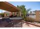 Patio with table and chairs, under covered pergola at 1972 S Clubhouse Dr, Casa Grande, AZ 85194
