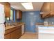Kitchen with wood cabinets and blue tile backsplash at 1972 S Clubhouse Dr, Casa Grande, AZ 85194