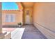 Front entry with arched entryway and stucco walls at 1247 E Marketplace Se Way, Phoenix, AZ 85048