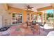 Relaxing patio with seating area, stone flooring, and access to backyard at 1247 E Marketplace Se Way, Phoenix, AZ 85048