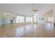 Bright living room with vaulted ceilings, tile floors, and large windows at 1247 E Marketplace Se Way, Phoenix, AZ 85048