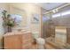 Bathroom with wood vanity and walk-in shower at 1247 E Marketplace Se Way, Phoenix, AZ 85048