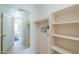 Large walk-in closet with shelving and rods at 1247 E Marketplace Se Way, Phoenix, AZ 85048