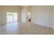 Bedroom with tile floors, access to patio, and bathroom at 1247 E Marketplace Se Way, Phoenix, AZ 85048