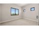 Bright bedroom with carpet flooring and large window at 16016 E Bobwhite Way, Scottsdale, AZ 85262