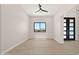 Light-filled entryway with tile floors and ceiling fan at 16016 E Bobwhite Way, Scottsdale, AZ 85262