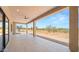 Spacious covered patio with tile flooring and views of the desert landscape at 16016 E Bobwhite Way, Scottsdale, AZ 85262