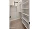 Spacious walk-in closet with built-in shelves and hanging rods at 16016 E Bobwhite Way, Scottsdale, AZ 85262