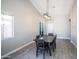 Dining room with dark wood table and gray tile floor at 4878 E Meadow Lark Way, San Tan Valley, AZ 85140