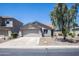 One story home with gray exterior and two-car garage at 4878 E Meadow Lark Way, San Tan Valley, AZ 85140