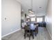 Dining room with a large table and modern chandelier at 4878 E Meadow Lark Way, San Tan Valley, AZ 85140