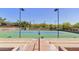 Well-maintained tennis courts with ample space and seating at 41417 N Clear Crossing Rd, Anthem, AZ 85086