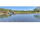 Peaceful waterfront view with a waterfall and lush landscaping at 41417 N Clear Crossing Rd, Anthem, AZ 85086