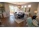 Bright dining room with an adjacent kitchen and access to the backyard patio at 41417 N Clear Crossing Rd, Anthem, AZ 85086