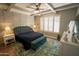 Relaxing main bedroom with high ceilings, neutral decor, and en-suite bath at 41417 N Clear Crossing Rd, Anthem, AZ 85086