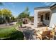 Landscaped backyard oasis with patio, grill, and desert plants at 41417 N Clear Crossing Rd, Anthem, AZ 85086