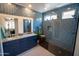 Spa-like bathroom with a large walk-in shower, double vanity and blue tile at 41417 N Clear Crossing Rd, Anthem, AZ 85086