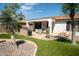 Outdoor entertaining area with patio, grill, and lush landscaping at 41417 N Clear Crossing Rd, Anthem, AZ 85086