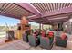 Relaxing patio area with fireplace and comfortable seating at 41417 N Clear Crossing Rd, Anthem, AZ 85086