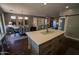Open concept kitchen with an island and breakfast bar, overlooking dining area at 41417 N Clear Crossing Rd, Anthem, AZ 85086