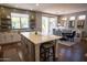 Updated kitchen with a large island and open layout to dining area at 41417 N Clear Crossing Rd, Anthem, AZ 85086