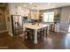 Modern kitchen featuring white cabinets, stainless steel appliances, and an island at 41417 N Clear Crossing Rd, Anthem, AZ 85086