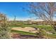 Expansive view of a golf course with sand traps and desert landscape at 41417 N Clear Crossing Rd, Anthem, AZ 85086